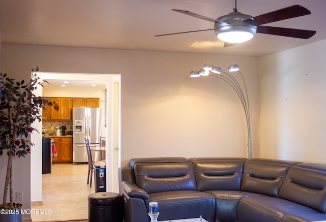 living room with light tile patterned floors and ceiling fan