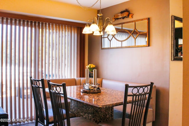 dining area featuring a chandelier