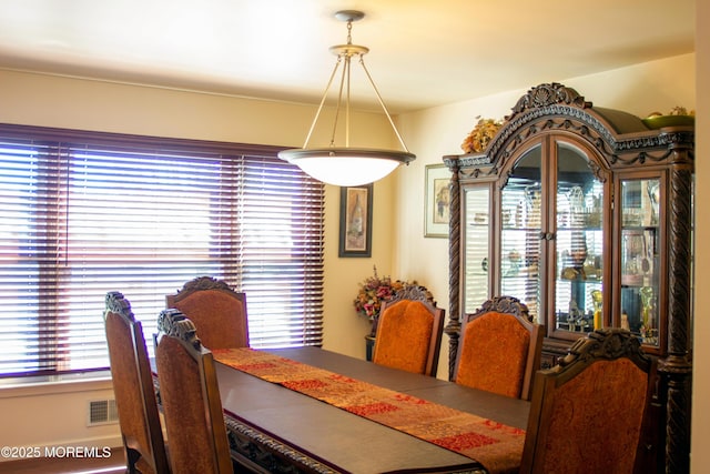 dining area featuring visible vents