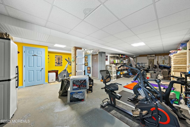 workout room with a paneled ceiling