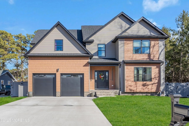 view of front facade with a garage, concrete driveway, roof with shingles, fence, and a front yard