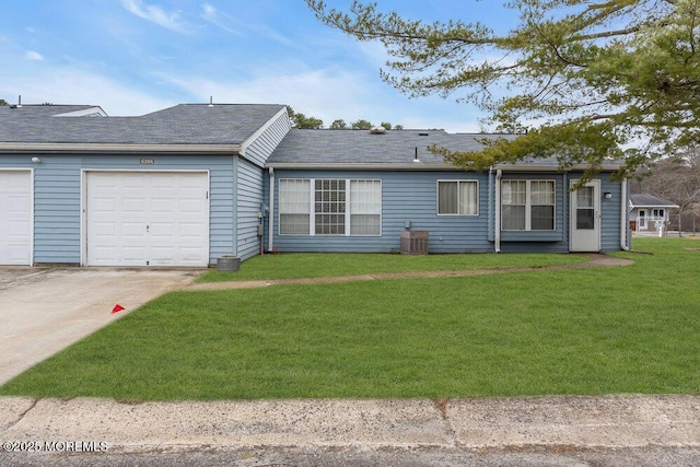 single story home featuring central AC, a front lawn, and an attached garage