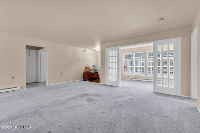 spare room with a baseboard radiator and carpet flooring