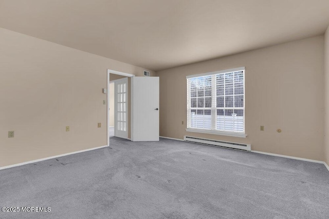 carpeted empty room featuring a baseboard heating unit, visible vents, and baseboards