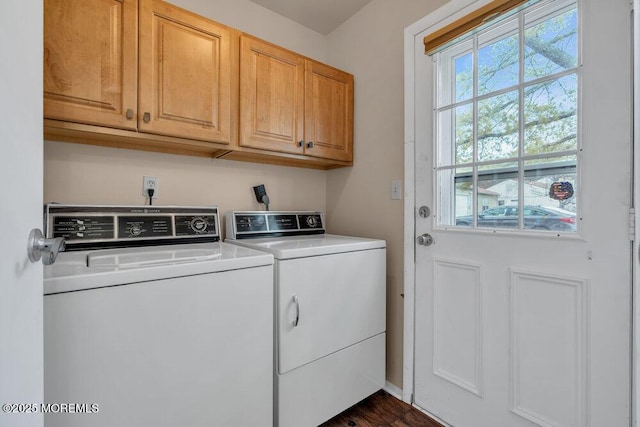 laundry room with cabinet space and washer and clothes dryer