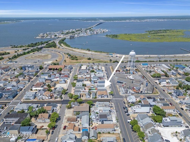 birds eye view of property with a residential view and a water view