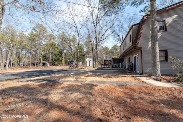 view of home's exterior featuring a shed and an outdoor structure