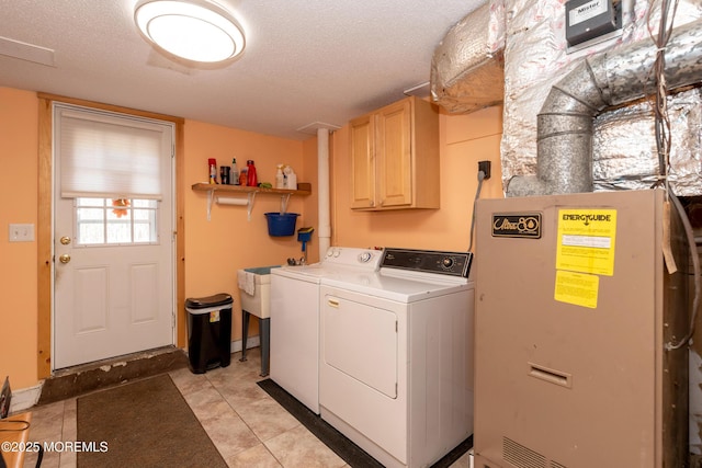 laundry room featuring a textured ceiling, visible vents, cabinet space, and washer and dryer