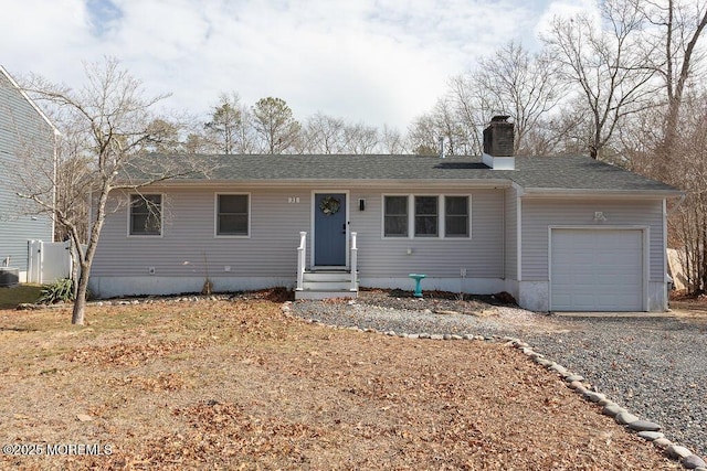 ranch-style house featuring a shingled roof, entry steps, cooling unit, a chimney, and a garage