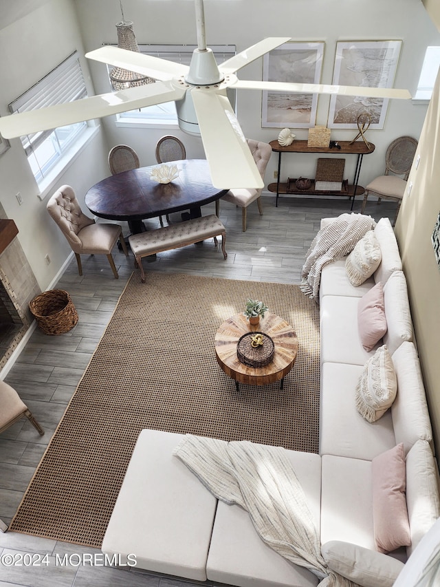 living area with wood finish floors and a skylight