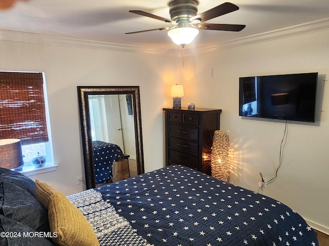 bedroom featuring a ceiling fan and crown molding