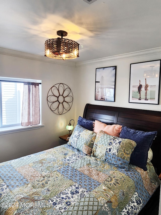 bedroom with crown molding