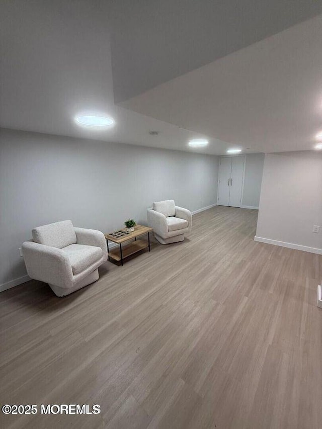 unfurnished room featuring light wood-style floors and baseboards