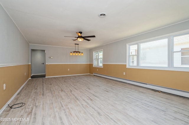 unfurnished living room featuring visible vents, ornamental molding, ceiling fan with notable chandelier, wood finished floors, and a baseboard radiator