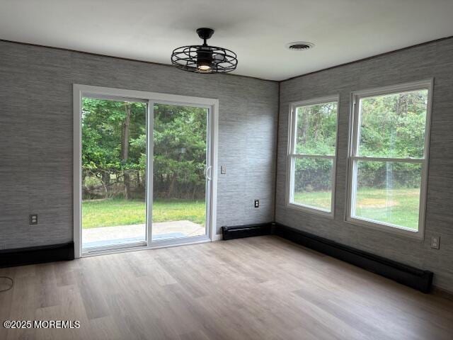 177 Freeport Blvd, Toms River, NJ 08757 - unfurnished dining area with healthy amount of natural light, wood finished floors, and ceiling fan