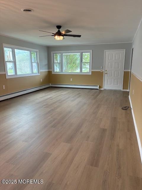 177 Freeport Blvd, Toms River, NJ 08757 - unfurnished living room with ceiling fan, plenty of natural light, wood finished floors, and baseboards