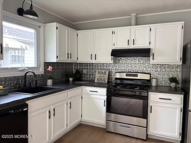177 Freeport Blvd, Toms River, NJ 08757 - kitchen featuring black appliances, a sink, dark countertops, under cabinet range hood, and white cabinetry