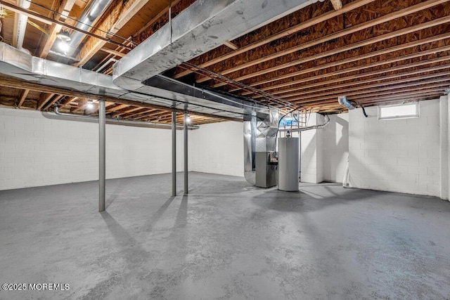 basement featuring water heater and heating unit