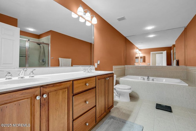 bathroom featuring tile patterned flooring, visible vents, a stall shower, a bath, and a sink