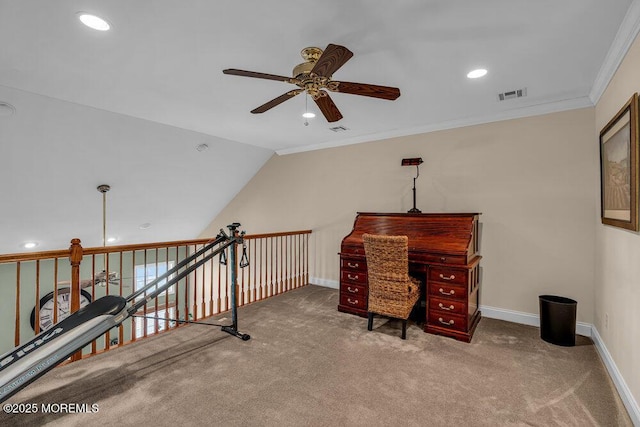 carpeted office space featuring visible vents, crown molding, baseboards, ceiling fan, and vaulted ceiling