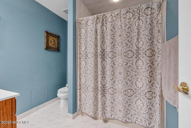 full bathroom with baseboards, toilet, and vanity