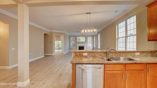 kitchen featuring visible vents, stainless steel dishwasher, ornamental molding, open floor plan, and a sink