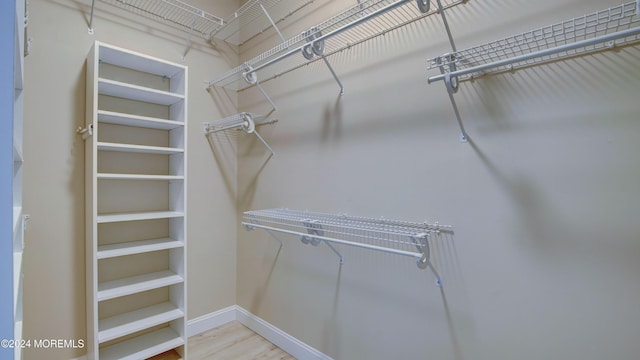 spacious closet with wood finished floors