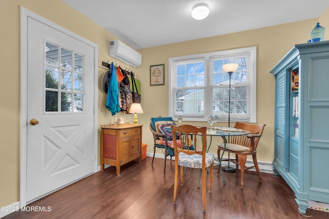 interior space with a baseboard radiator, baseboards, dark wood-type flooring, and an AC wall unit