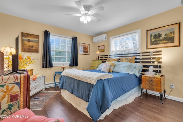 bedroom with a wall unit AC, multiple windows, a baseboard heating unit, and wood finished floors