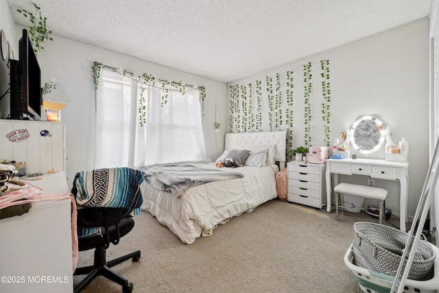 carpeted bedroom featuring a textured ceiling