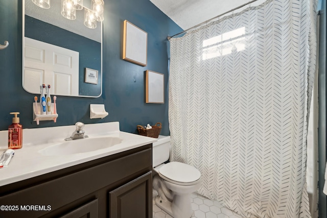 full bathroom featuring vanity and toilet