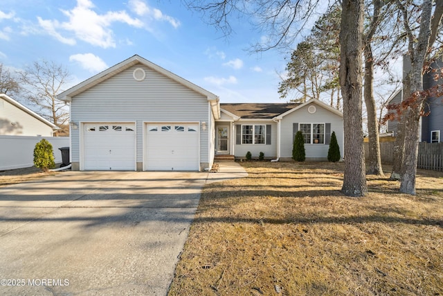 ranch-style house featuring concrete driveway, fence, and a garage