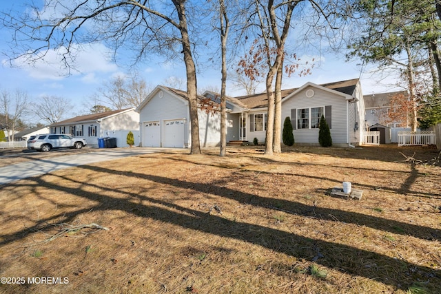 view of front facade with a garage and concrete driveway