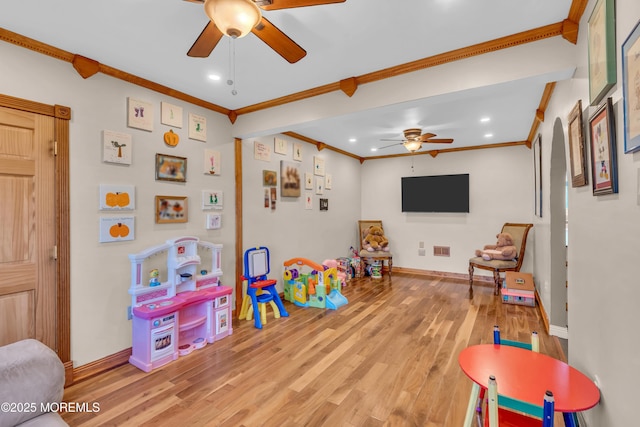 playroom featuring visible vents, recessed lighting, light wood-style floors, crown molding, and baseboards