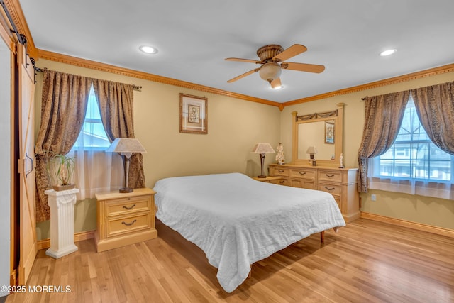 bedroom with multiple windows, light wood-style flooring, and crown molding