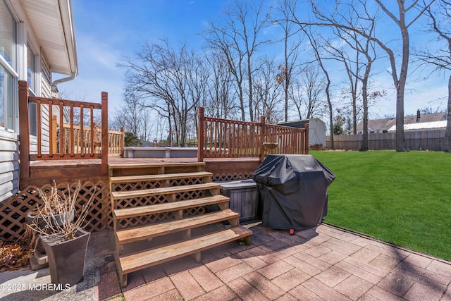 view of patio / terrace with a deck, fence, and grilling area