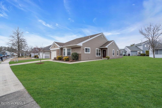 single story home featuring a front yard, brick siding, driveway, and an attached garage