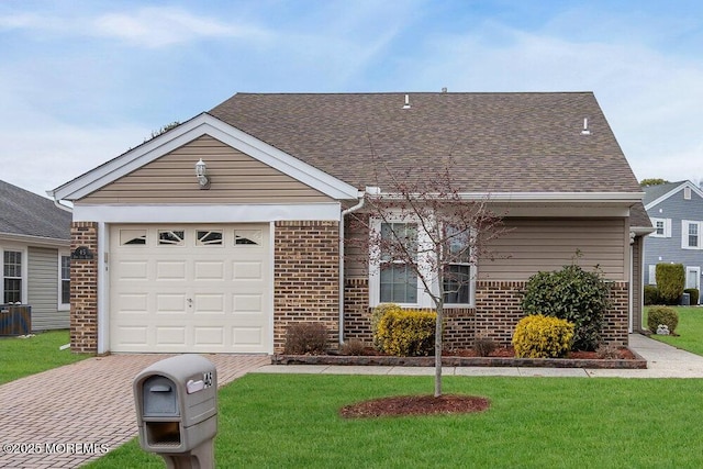 view of front of home with central AC unit, an attached garage, brick siding, roof with shingles, and a front yard