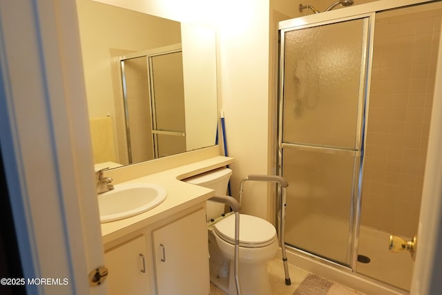 full bathroom with tile patterned floors, a shower stall, toilet, and vanity