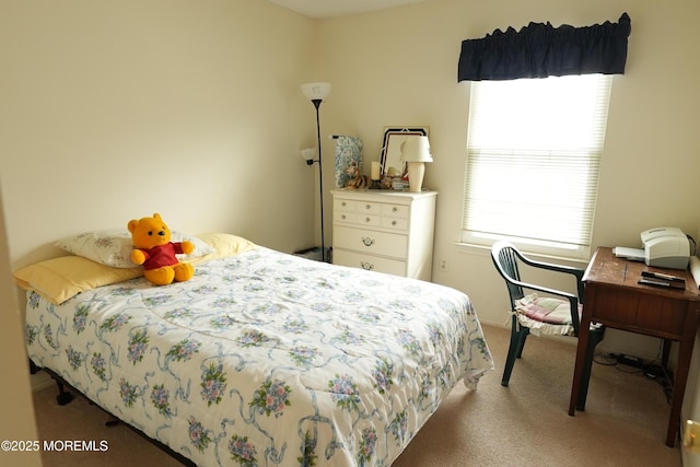 bedroom featuring light carpet