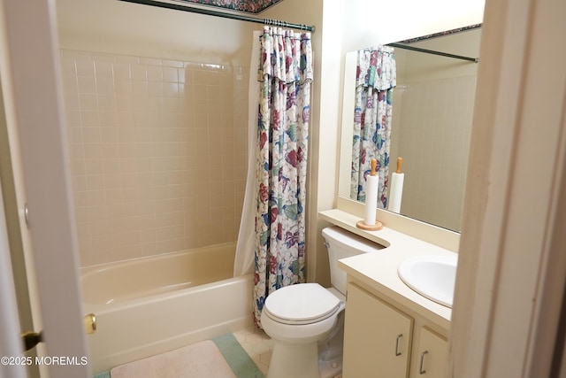 bathroom with vanity, shower / bath combo with shower curtain, and toilet