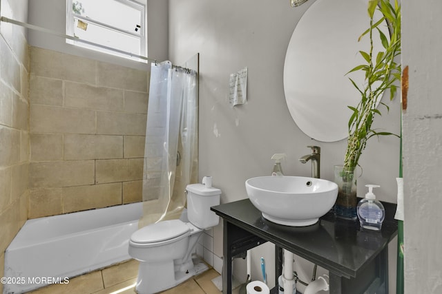 full bathroom with shower / bath combination with curtain, tile patterned flooring, vanity, and toilet