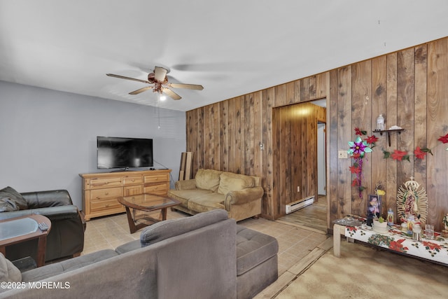 living room featuring a baseboard heating unit, wood walls, and a ceiling fan