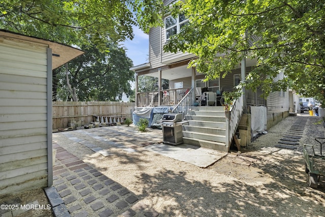 view of patio featuring fence and grilling area