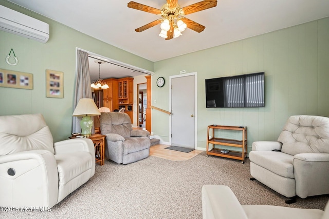 carpeted living room with ceiling fan with notable chandelier and a wall mounted AC