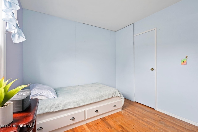 bedroom featuring wood finished floors