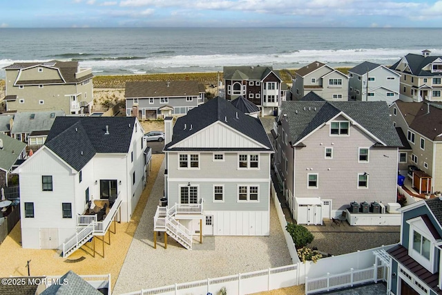 bird's eye view featuring a residential view and a water view