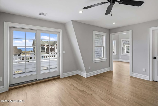 interior space with recessed lighting, a ceiling fan, visible vents, baseboards, and light wood-type flooring