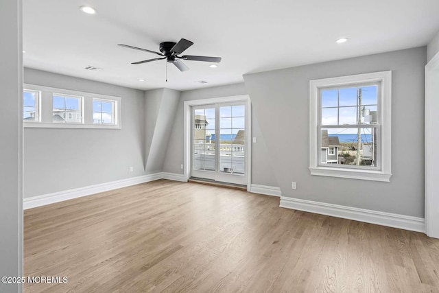 spare room with a ceiling fan, recessed lighting, baseboards, and wood finished floors