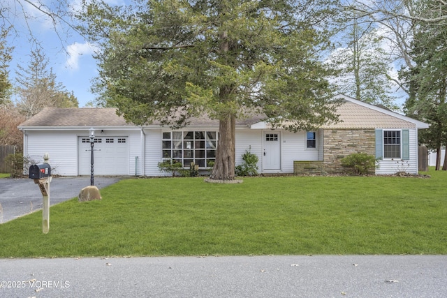 ranch-style home featuring a garage, stone siding, a front lawn, and aphalt driveway